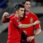 Spain’s Villa and team mate Torres celebrate after Torres scored the first goal during their Euro 2012 qualifying soccer match against Liechtenstein in Vaduz